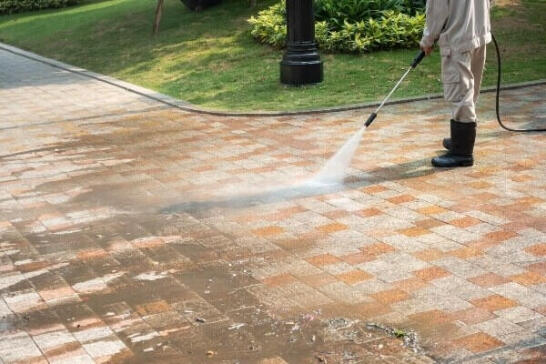 Residential Power Washing Services by APS Charlotte Driveway pressure washing removing dirt and grime with high-powered water cleaning